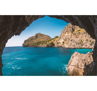 Cave with views of an island under the sea wall mural - TenStickers