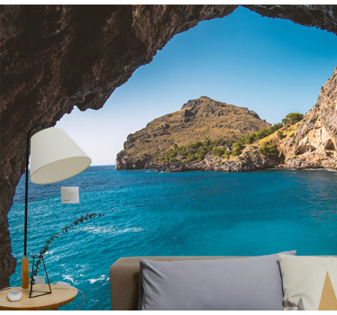 Cave with views of an island under the sea wall mural - TenStickers