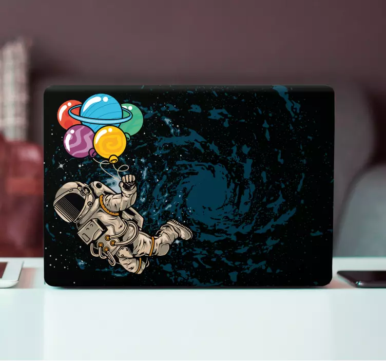 Astronaut floating  with balloons laptop skins - TenStickers