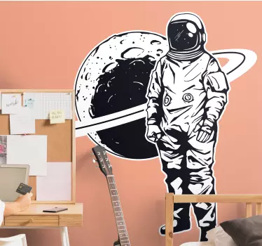 Design of astronaut with planet bedroom sticker - TenStickers